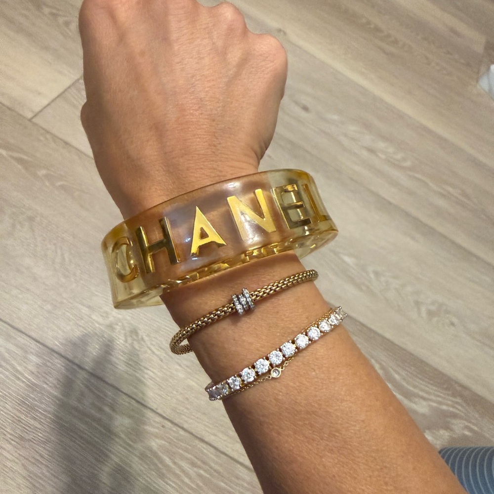 Vintage CHANEL Amber-Tone Lucite Bangle with Gold Signature Plaque